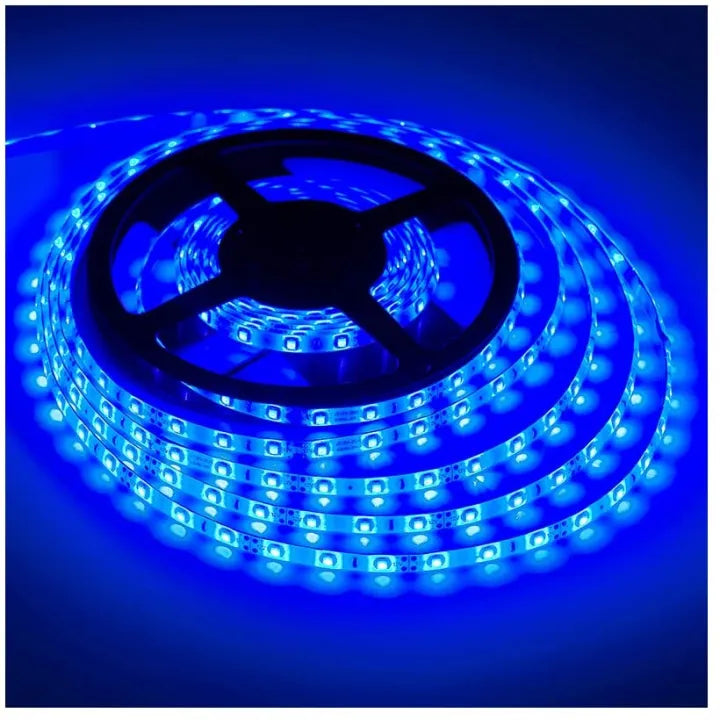 Roll of blue LED strip light on a dark background