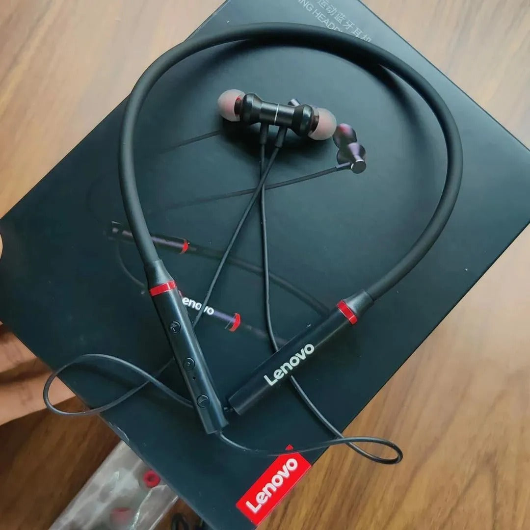 Lenovo earphones on a Lenovo product box with a wooden surface background