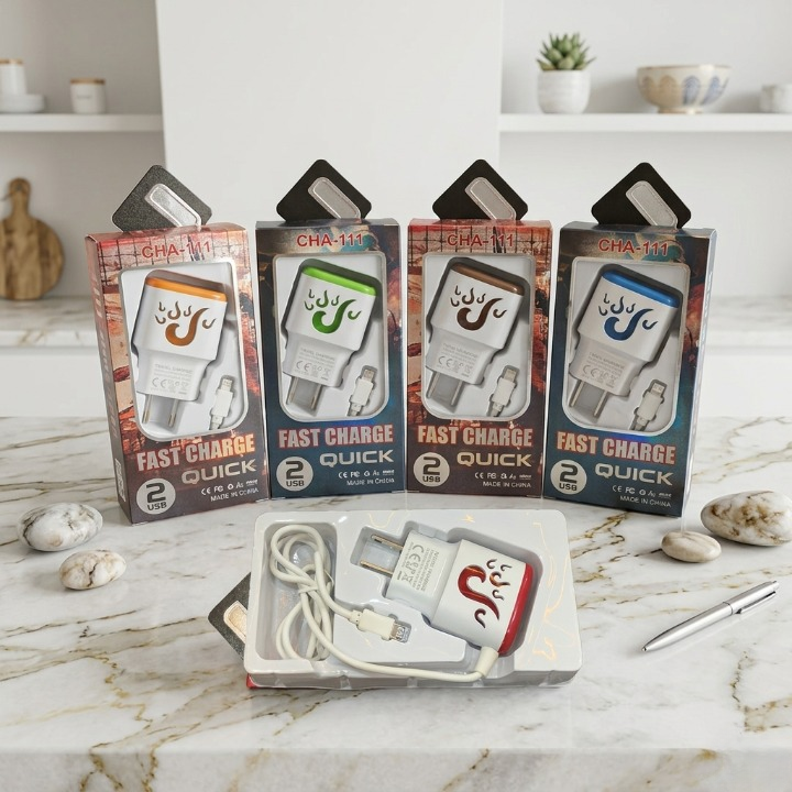 Four packages of 'Fast Charge Quick' USB chargers on a marble surface with a white background.